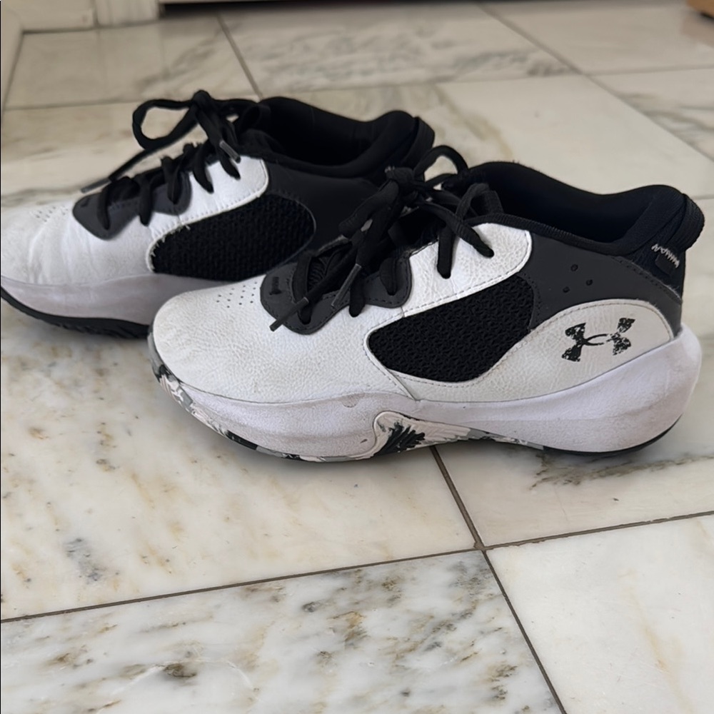 Under Armour Basketball Kids' Black and White Sneakers.  Good used condition.